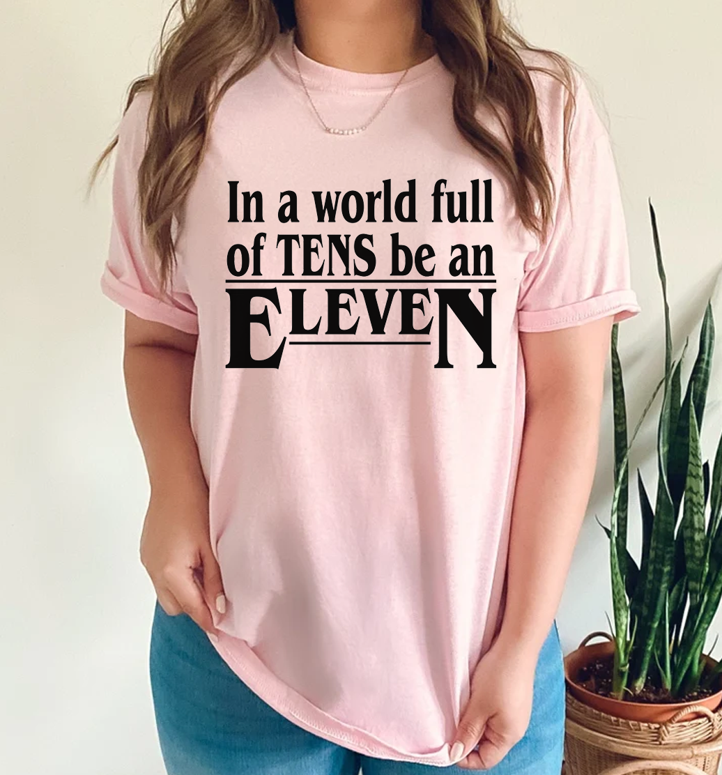 In a World of Tens Be an Eleven - soft pink T-Shirt